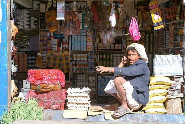 Man selling food on his small shop at Habbabah stock photo
