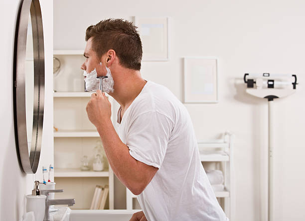 Man Shaving Face stock photo