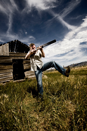 Man Shooting Gun Stock Photo - Download Image Now - iStock