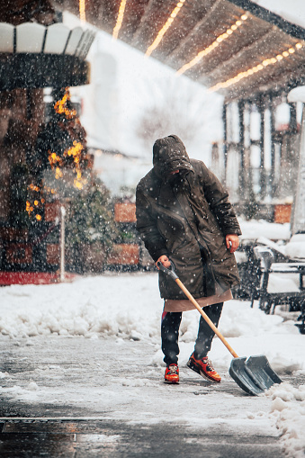 Cleaning the snow on the street after a blizzard
