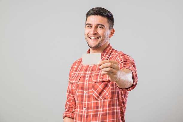 Man showing blank business card stock photo
