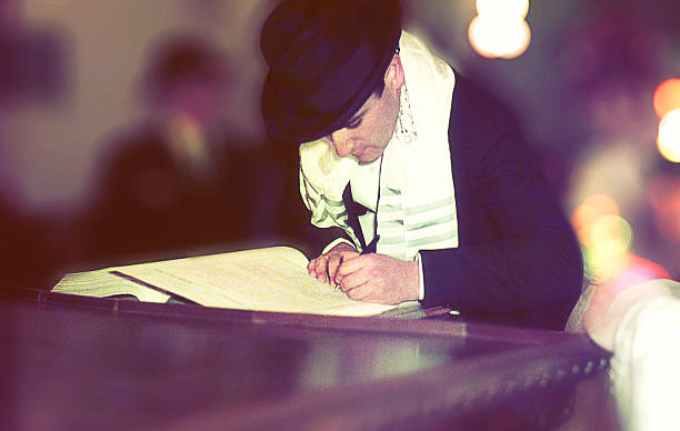 Man signing ketubah at a jewish wedding Vintage photo featuring a man signing ketubah at a jewish wedding. ketubah stock pictures, royalty-free photos & images