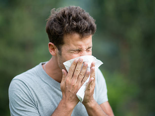 Man Sneezing Handsome Man sneezing snorting stock pictures, royalty-free photos & images