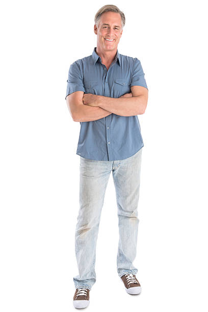 Man Standing Arms Crossed Against White Background stock photo