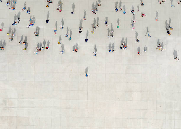 Man standing out of a Crowd Man standing out of a Crowd aerial view stock pictures, royalty-free photos & images