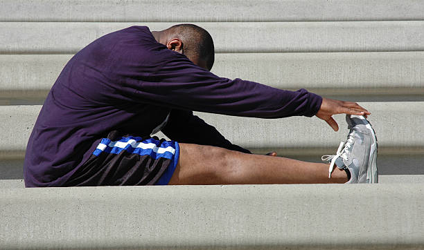 Man Stretches for Race stock photo
