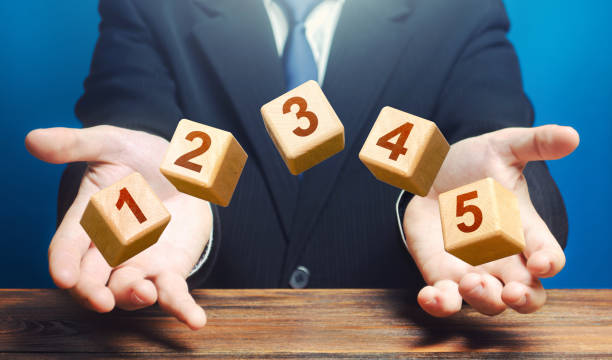 Man throws 5 numbered blocks with the numbers one two three four five from his hands. Five easy steps. Organization and systematization, step by instructions. Business planning, action plan. Man throws 5 numbered blocks with the numbers one two three four five from his hands. Five easy steps. Organization and systematization, step by instructions. Business planning, action plan. human made stock pictures, royalty-free photos & images