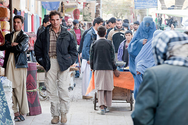 Man walking in downtown Kabul stock photo