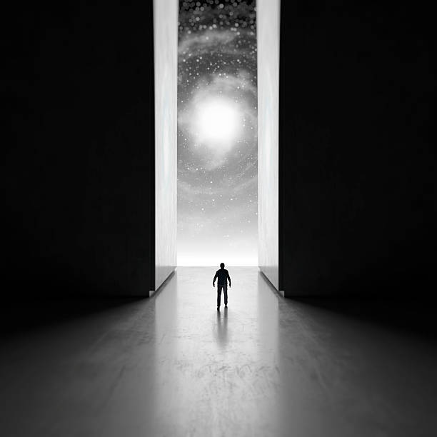 man walking through interdimensional passage - black hole 個照片及圖片檔