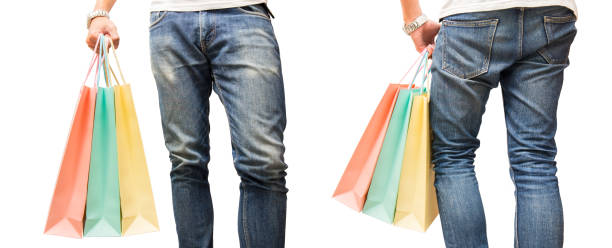 man wear jean and hold colorful shopping bag in hand on isolated background stock photo