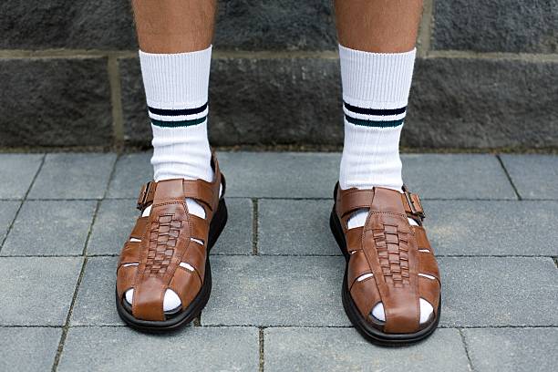 Man wearing sandals  sock stock pictures, royalty-free photos & images