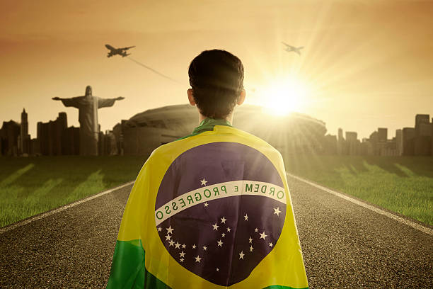 Man with Brazilian flag on the road stock photo