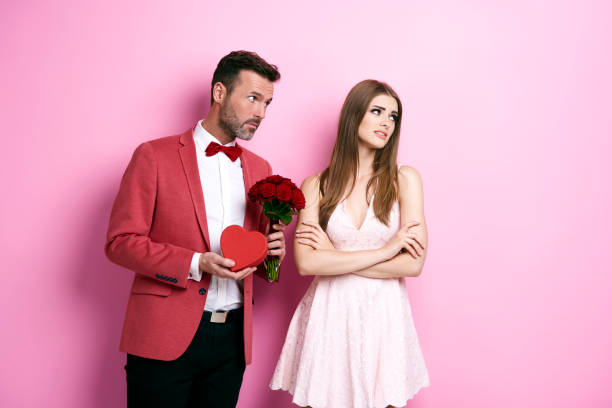 Man with bunch of rose and chocolate box apologizing fiance Man with bunch of rose and chocolate box apologizing fiance rejection stock pictures, royalty-free photos & images