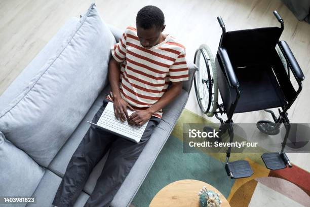 Man with Disability Relaxing at Home Top View