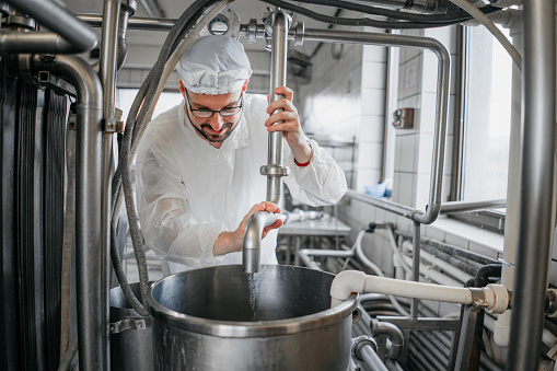 Man working at a dairy factory