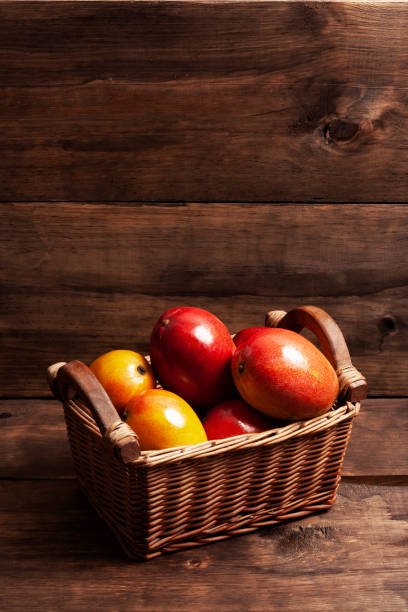 Mango fruit in basket stock photo