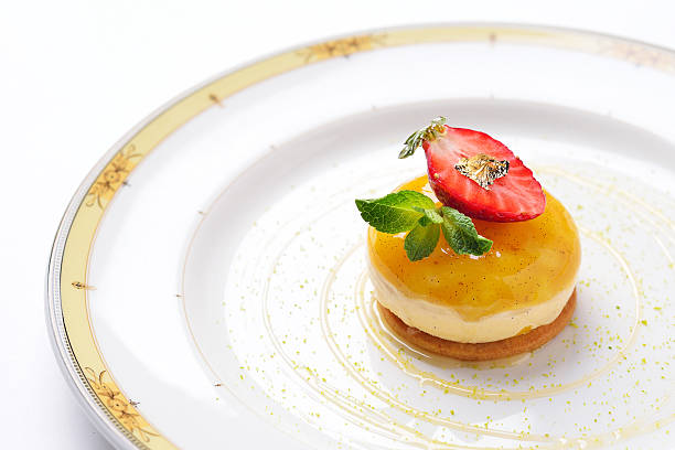 mango mousse with strawberry cream on strawberry biscuit stock photo