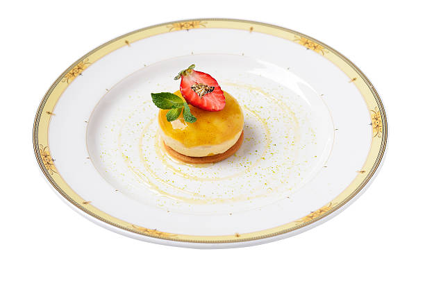 mango mousse with strawberry cream on strawberry biscuit stock photo