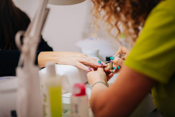 Manicure treatment Manicure, Fingernail, Adult, Applying nail salon stock pictures, royalty-free photos & images
