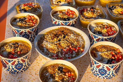 Ashura desserts on the table, shot from above.Sunset