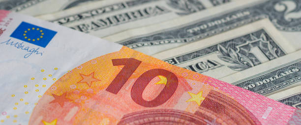 many different american dollars and european union euro banknotes close-up shot stock photo