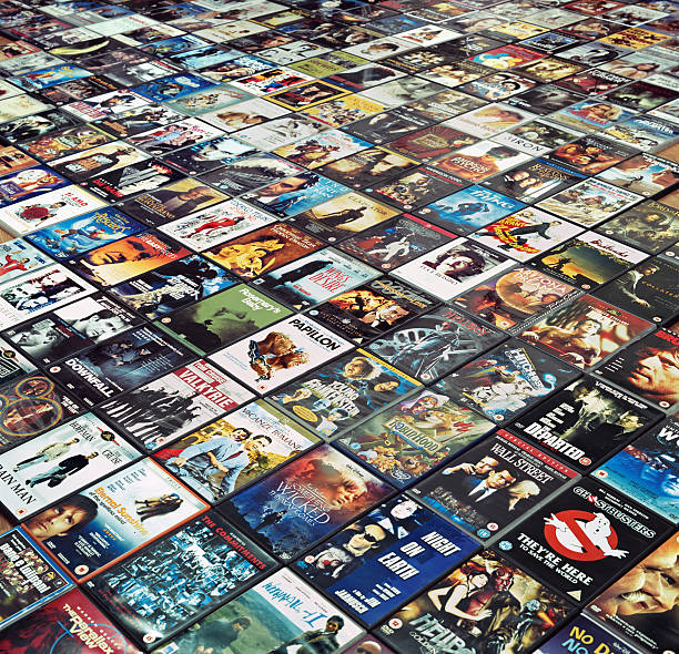 Many DVDs are arranged side by side on the floor stock photo