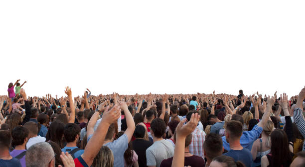 many happy people with raised hands stock photo