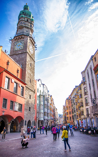 Innsbruck, Austria; 18 October 2018. Many people visit at old town historic street and tower in Innsbruck, Austria