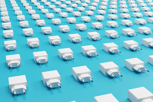 Many phone chargers in a rows over blue background, 3d rendering of power adapters for mobile phones and devices.