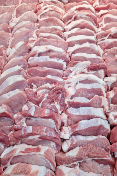 many pieces of fresh red pork meat food background stock photo