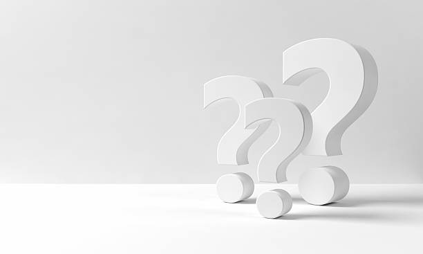 Many question marks on a neutral white background stock photo