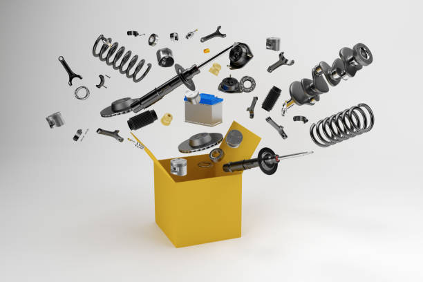 Many spare parts flying out of the box gray background. Isolated auto spare parts on gray background. 3D rendering stock photo