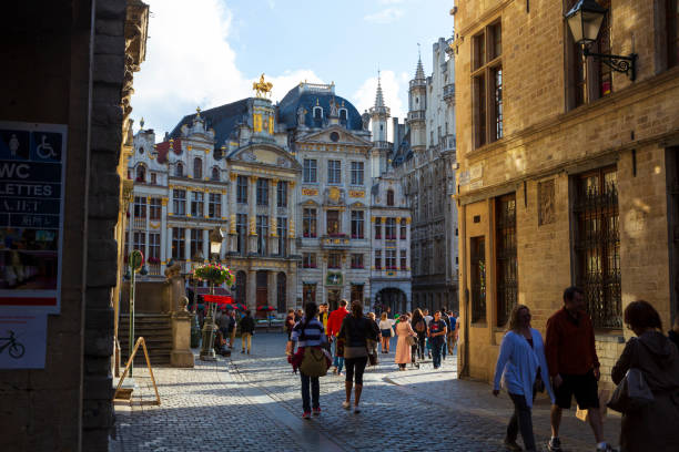 Many tourists visit the Grand Place in Brussels, Belgium stock photo