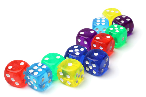 Many-colored dice set on white background