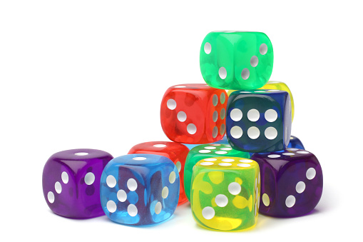 Many-colored dice set on white background