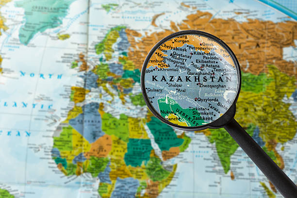 Map of Kazakhstan Map of Kazakhstan through magnifying glass central asia stock pictures, royalty-free photos & images