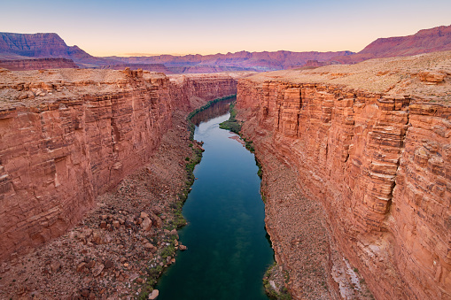 Landscape stock photograph of the Marble Canyon and the Colorado River as seen from the Navajo Bridge in Arizona USA just after sunset.