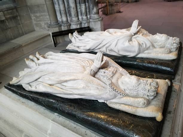Marble recumbent effigies of Henry II and Catherine de' Medici in a chapel in the northern chevet in Basilica Cathedral of Saint-Denis stock photo