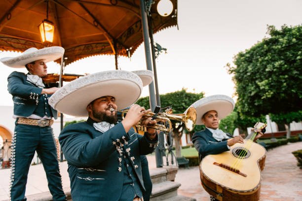 Mariachi Band Playing Mariachi Band Playing under Mexican Kiosk mexican independence day stock pictures, royalty-free photos & images