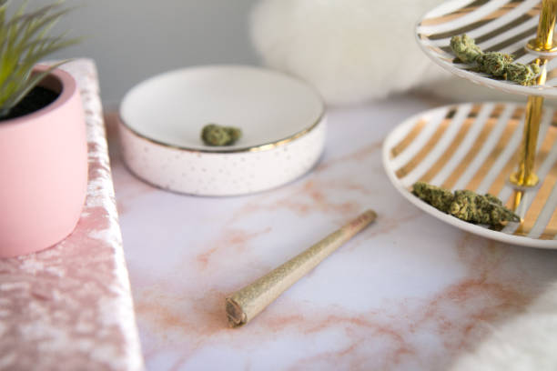 Marijuana Joint on Pink Marble Vanity Luxury Cannabis stock photo