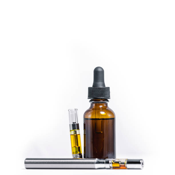 Marijuana Oil Dropper and Vape Pen on White Backgorund stock photo