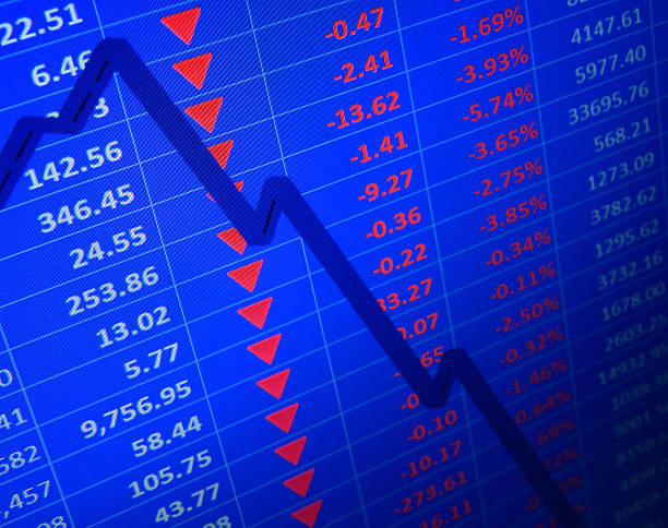 Market Crashes Arrows and graph line showing a distinct downward trend. Close-up of an LCD screen.The point of focus is where the arrows interset the graph. In this area the individual pixels on the screen can clearly be seen. STOCK MARKET  stock pictures, royalty-free photos & images