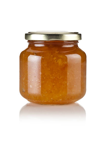 Marmalade Marmalade Jar Isolated on White Background marmalade stock pictures, royalty-free photos & images