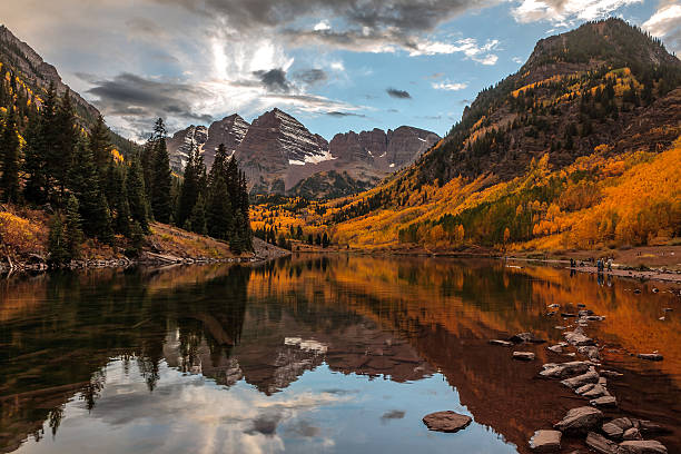 Maroon Bells in Morning Glow Sunrise at Maroon Bells in late fall, Aspen, Colorado. aspen colorado stock pictures, royalty-free photos & images