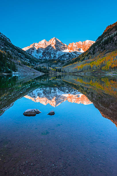 Maroon Bells Sunrise Aspen Colorado Vertical Composition reflect stock photo