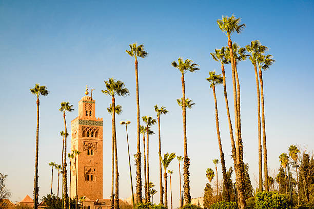 Marrakech Koutoubia Koutoubia minaret in Marrakech with palm trees. koutoubia mosque stock pictures, royalty-free photos & images