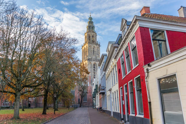 Martini church tower in the late afternoon autumn in Groningen, The Netherlands Martini church tower in the late afternoon autumn in Groningen, The Netherlands groningen city stock pictures, royalty-free photos & images