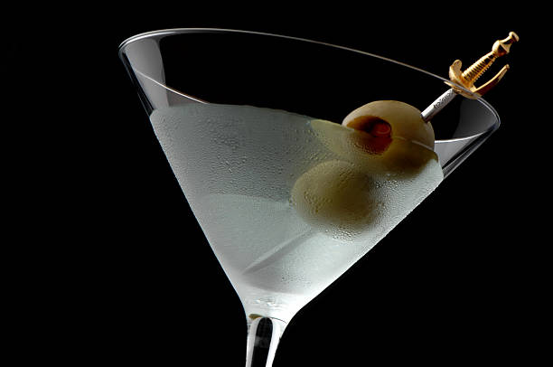 Martini Cocktail with Olives on Black Quintessential Martini  dirty martini stock pictures, royalty-free photos & images