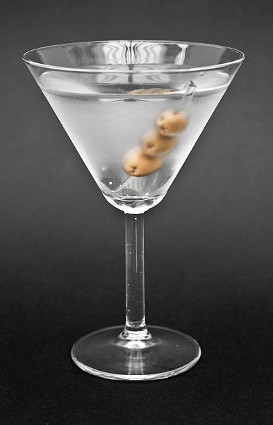 Martini in cocktail glass on black background James Bond Martini dirty martini stock pictures, royalty-free photos & images