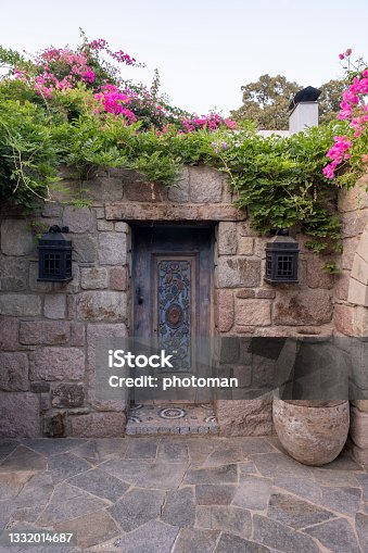 istock A marvelous crafted ornate door entrance at an ancient stone house 1332014687